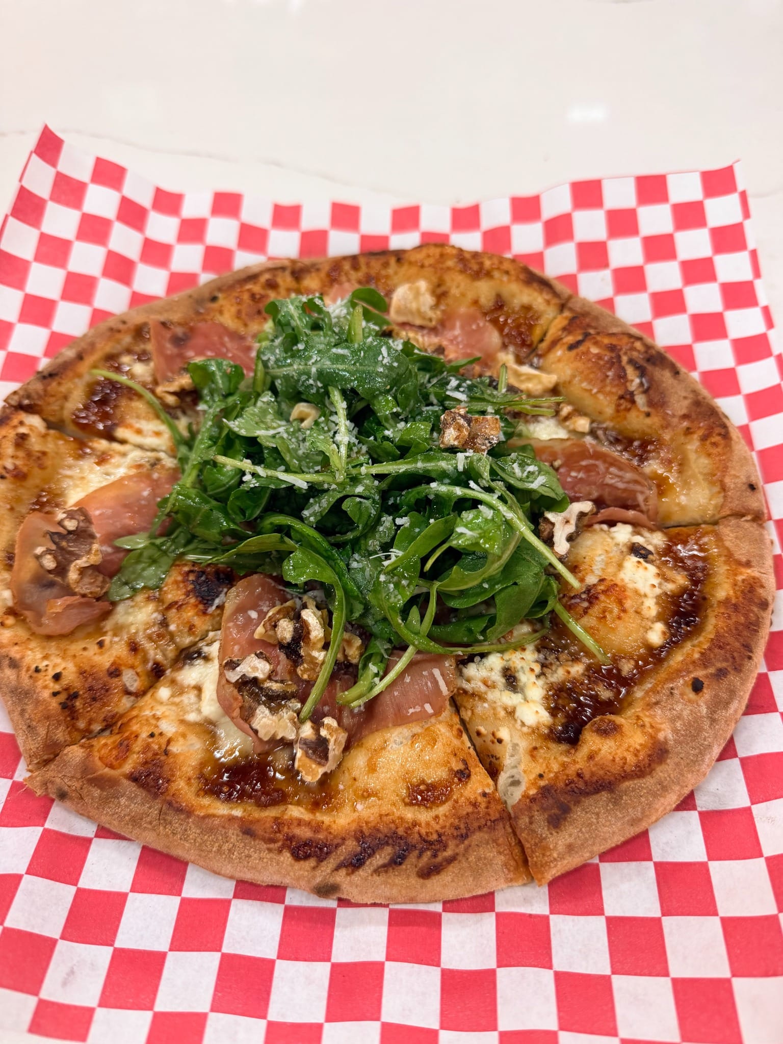 Fig and Pig pizza with prosciutto, arugula and walnuts